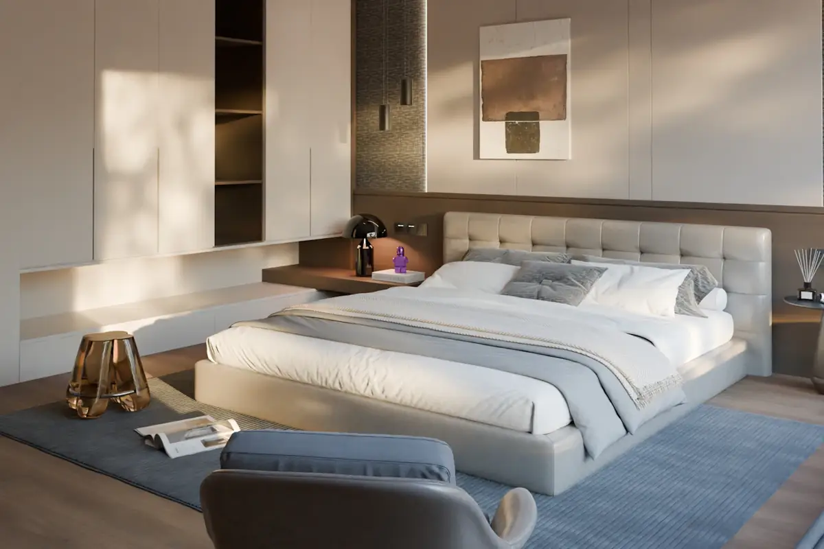 A neatly made bed in a bright, minimalist bedroom
