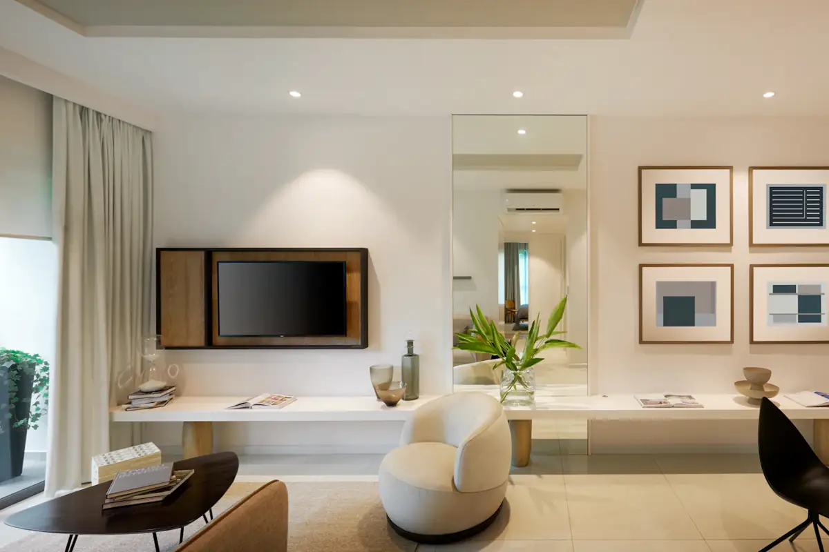 A modern apartment living room with an armchair and framed artwork